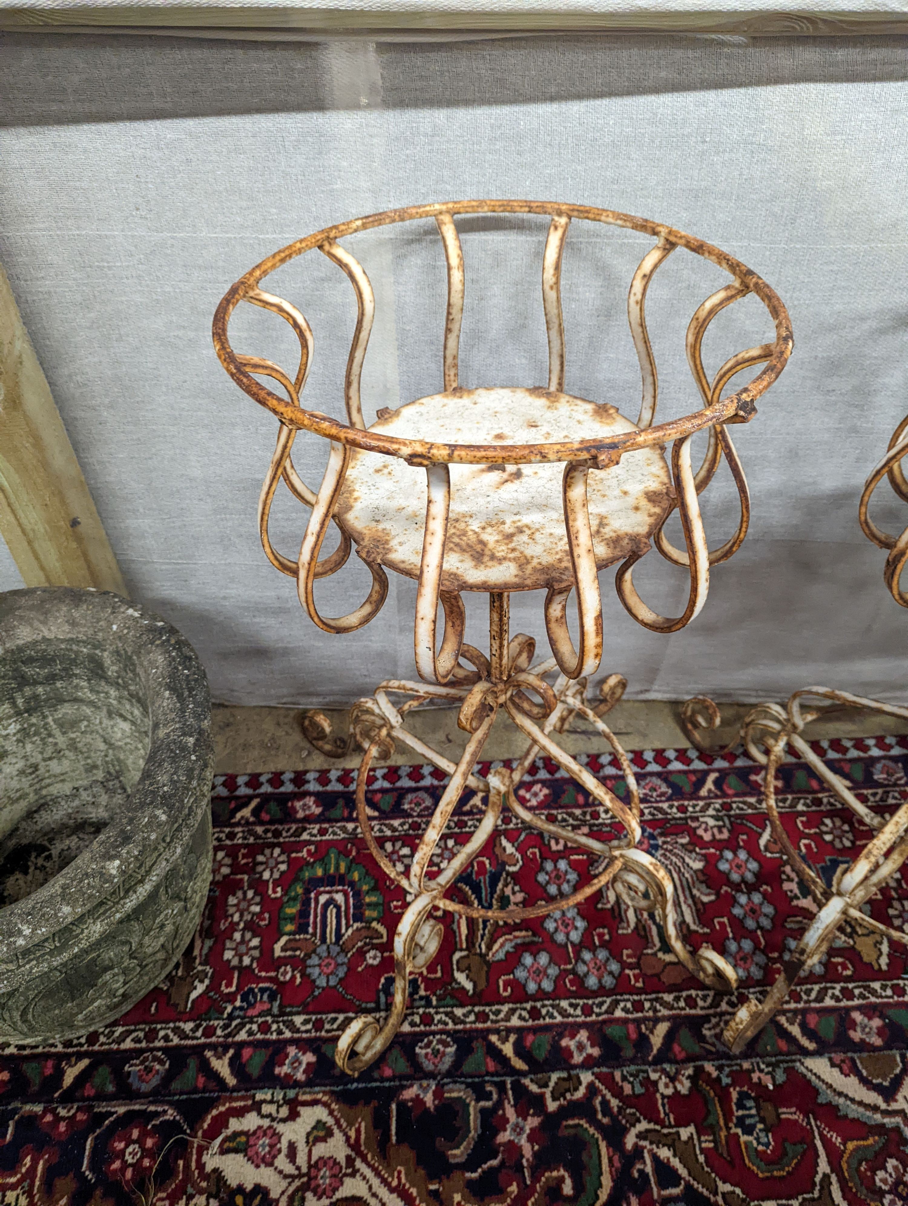 A pair of painted wrought iron garden planters, diameter 40cm, height 74cm